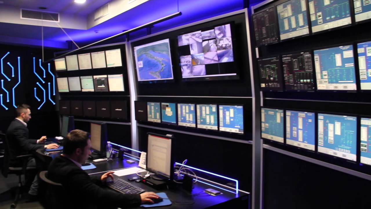 Security control room operators monitoring screens